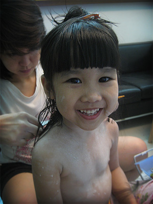 Cleo getting her hair cut by mommy
